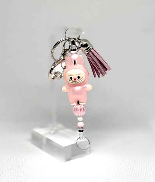 Handmade silver key chain inspired by the Labubu character. Featuring leather tassel and pink Labubu character charm. Perfect
For Labubu fans and collectors. 