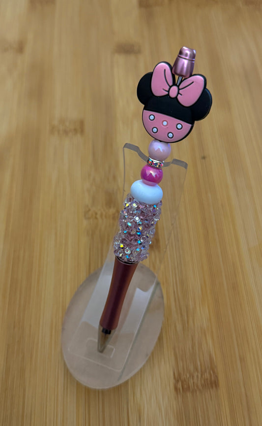 Handmade beaded pen inspired by Minnie Mouse, featuring pink and white beads with a Minnie Mouse character bead 